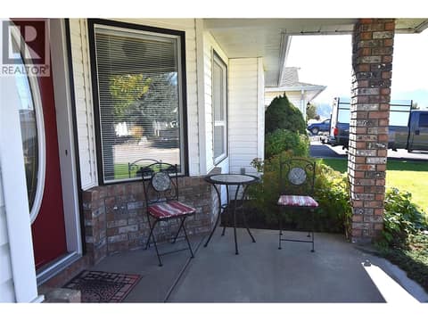 Small sitting area by the front entry at 415 4 Street, Swan Lake West, Vernon