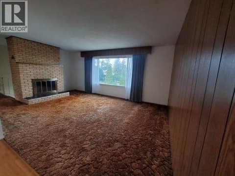 Upstairs living room - photo taken 2023 prior to current tenant moving in at 683 Downie Road, South BX, Vernon