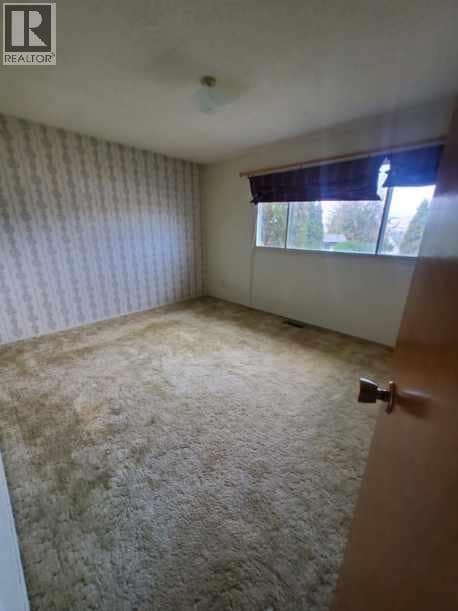 Upstairs primary bedroom - photo taken 2023 at 683 Downie Road, South BX, Vernon