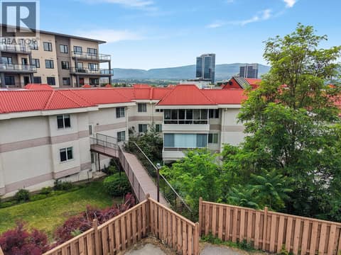 Backyard green area fenced in. at 1534 LAWRENCE Avenue Unit# 304, Glenmore, Kelowna