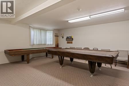 Enjoy a game of pool located Rec room, which also has a kitchen. at 1534 LAWRENCE Avenue Unit# 304, Glenmore, Kelowna