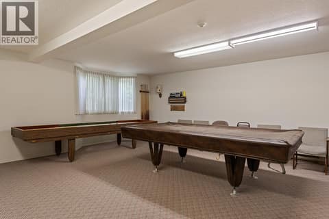Enjoy a game of pool located Rec room, which also has a kitchen. at 1534 LAWRENCE Avenue Unit# 304, Glenmore, Kelowna