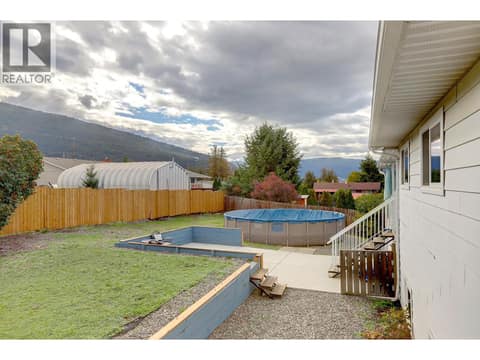 From Primary Bedroom Deck to back yard at 5723 Richards Crescent, North BX, Vernon