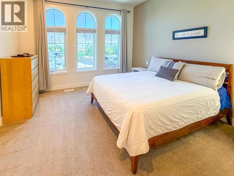 The lovely arched bedroom windows. at 8000 Vedette Drive Unit# 36, Osoyoos