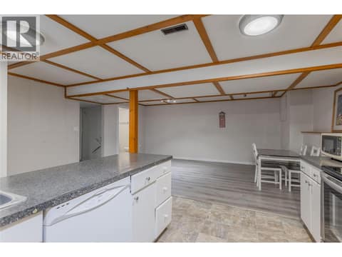 Basement Suite Kitchen Looking into Living/ Dining Room at 3448 Old Okanagan Highway, Westbank Centre, West Kelowna