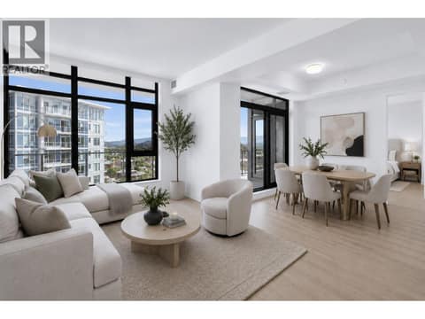 Floor to ceiling windows fill the open concept living space with natural light and connect seamlessly to the expansive outdoor entertaining area. *virtually staged at 3699 Capozzi Road Unit# PH6, Lower Mission, Kelowna