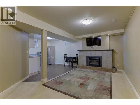 Cozy Living Room with Efficient Gas Heater at 565 Dougall Road S, Rutland South, Kelowna