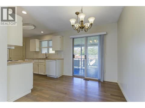 Dining Room opens to Spacious Covered Deck at 565 Dougall Road S, Rutland South, Kelowna