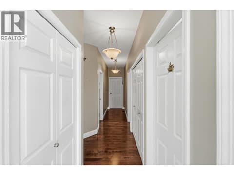 Main hallway to bedrooms 2 + 3 at 2166 Shannon Woods Way, Shannon Lake, West Kelowna