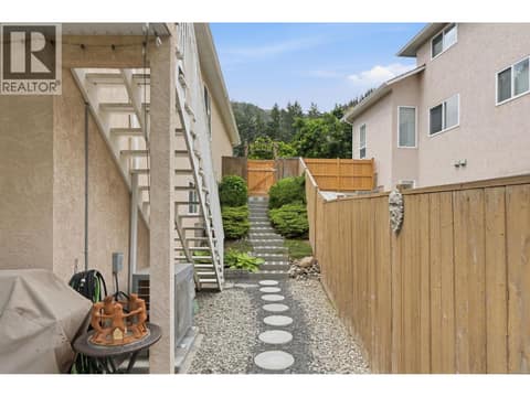 Stairs to deck and front yard at 2166 Shannon Woods Way, Shannon Lake, West Kelowna