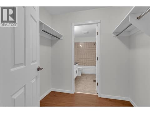 Primary walk-in closet at 1675 Thayer Court Unit# 3, Glenmore, Kelowna