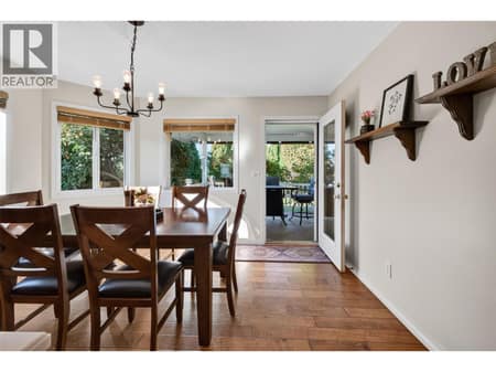 Exit to covered deck and yard at 1380 Loseth Drive, Black Mountain, Kelowna