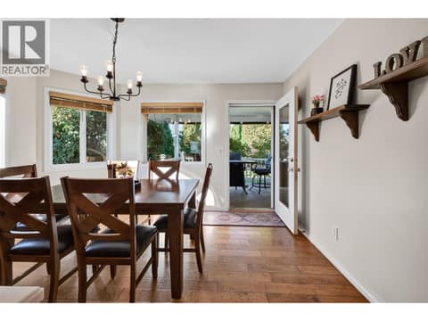 Exit to covered deck and yard at 1380 Loseth Drive, Black Mountain, Kelowna
