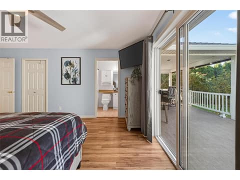 Large doors from primary to the deck and hot tub at 1380 Loseth Drive, Black Mountain, Kelowna