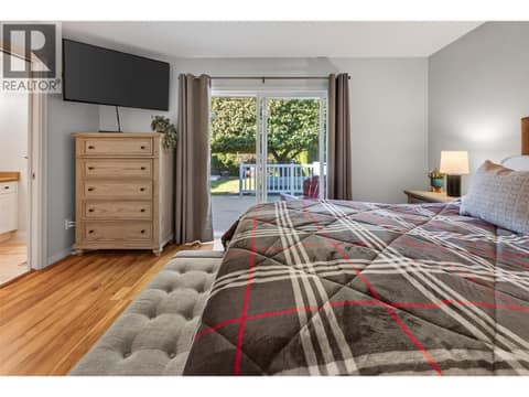 Large doors from primary to the deck and hot tub at 1380 Loseth Drive, Black Mountain, Kelowna