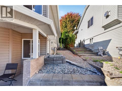 Side of home at 1380 Loseth Drive, Black Mountain, Kelowna