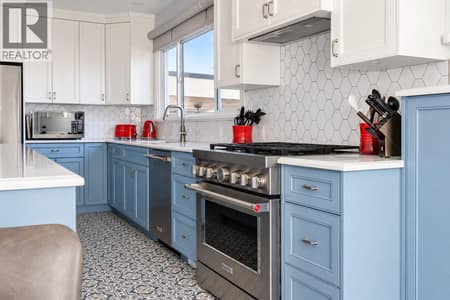 Completely renovated modern kitchen. May I add so pretty! at 2071 Abbott Street, Kelowna South