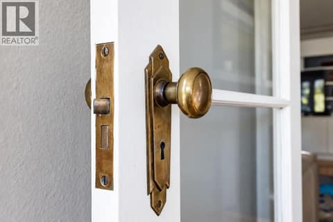 Original brass knobs add to the rustic charm. at 2071 Abbott Street, Kelowna South