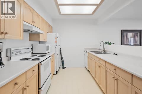Common Room Kitchen at 3335 Richter Street Unit# 201, Lower Mission, Kelowna