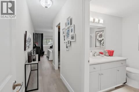 Hall to Primary Ensuite, walk-in closet and bedroom at 3335 Richter Street Unit# 201, Lower Mission, Kelowna