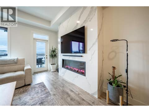 Living room with door to outside front deck at 881 Mt.Ida Drive, Middleton Mountain Vernon