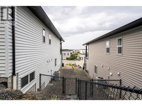Looking at the north side of the home , fenced back yard at 881 Mt.Ida Drive, Middleton Mountain Vernon