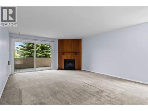 Main Level - Livingroom with   Covered Deck Access at 3000 Richter Street Unit# 6, Kelowna South