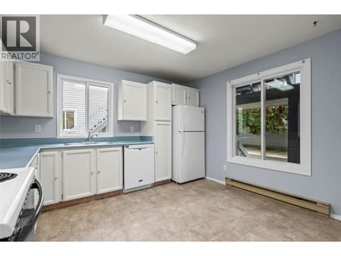Main Level - Spacious Kitchen with Large Windows at 3000 Richter Street Unit# 6, Kelowna South