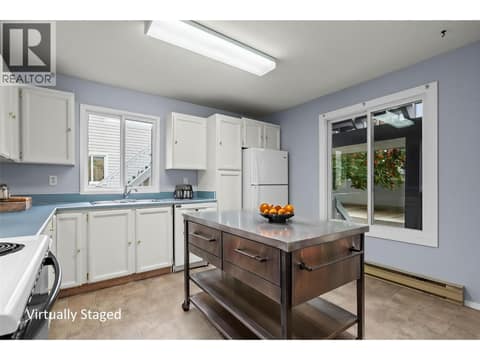 Virtually Staged: Main Level - Spacious Kitchen with Large Windows at 3000 Richter Street Unit# 6, Kelowna South