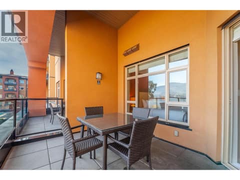 Covered balcony with glass railing at Unit 209. at 15 PARK Place Unit# 209, Osoyoos