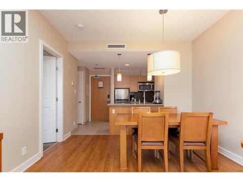 Dining area positioned between the living room and kitchen. at 15 PARK Place Unit# 209, Osoyoos