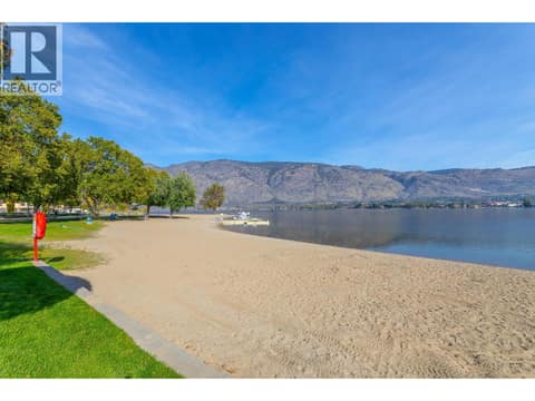 Sandy beach and calm water at Watermark Beach Resort. at 15 PARK Place Unit# 209, Osoyoos