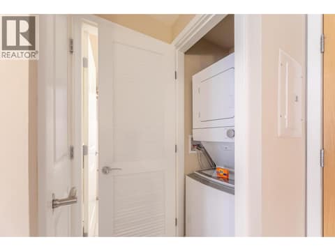 Stacked in-suite washer and dryer. at 15 PARK Place Unit# 209, Osoyoos