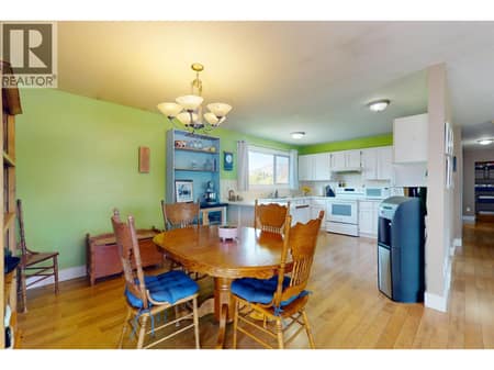 Open area in living room kitchen and dining area. at 620 Ziprick Road, Rutland South, Kelowna