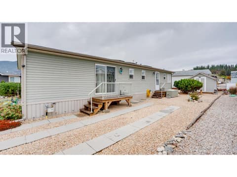 Driveway with access to dining and mudroom/laundry at 12560 Westside Road Unit# 15, Swan Lake West, Vernon