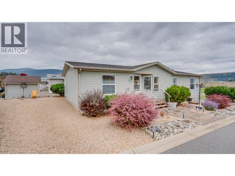 Front side yard~ good for RV or extra vehicle at 12560 Westside Road Unit# 15, Swan Lake West, Vernon