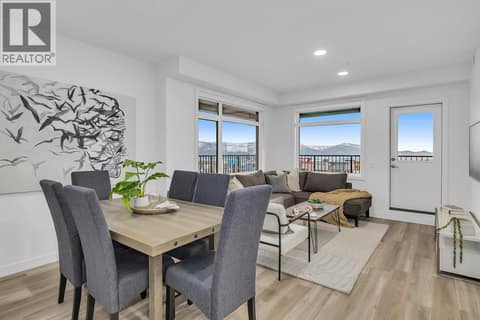 Dining & Living Room. Photos may be of a similar home in the community. at 1057 Frost Road Unit# 301, Upper Mission, Kelowna