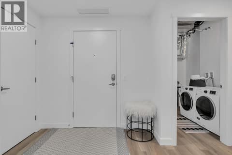 Foyer and Laundry. Photos may be of a similar home in the community. at 1057 Frost Road Unit# 301, Upper Mission, Kelowna