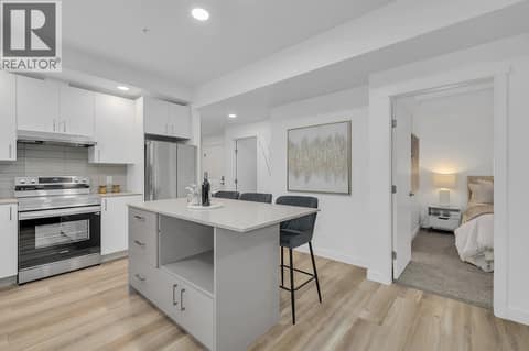 Kitchen. Photos may be of a similar home in the community. at 1057 Frost Road Unit# 301, Upper Mission, Kelowna