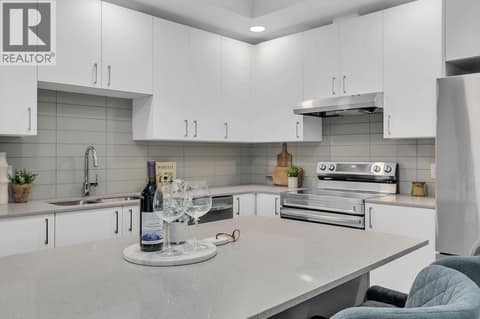 Kitchen. Photos may be of a similar home in the community. at 1057 Frost Road Unit# 301, Upper Mission, Kelowna
