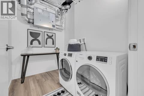 Laundry. Photos may be of a similar home in the community. at 1057 Frost Road Unit# 301, Upper Mission, Kelowna