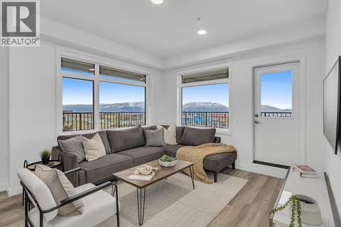 Living Room. Photos may be of a similar home in the community. at 1057 Frost Road Unit# 301, Upper Mission, Kelowna