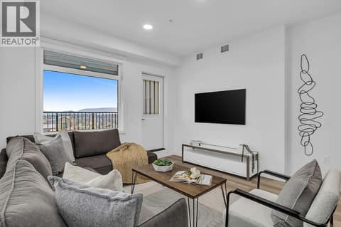 Living Room. Photos may be of a similar home in the community. at 1057 Frost Road Unit# 301, Upper Mission, Kelowna