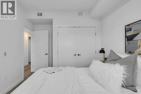 Third Bedroom. Photos may be of a similar home in the community. at 1057 Frost Road Unit# 301, Upper Mission, Kelowna