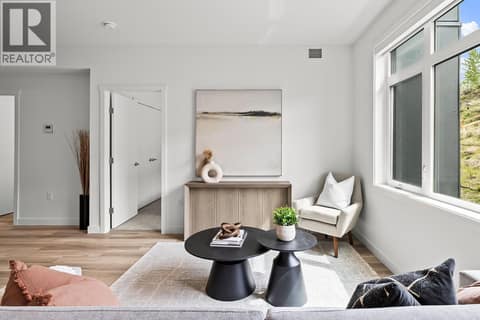 Living Room. Photos may be of a similar home in the community. at 1057 Frost Road Unit# 302, Upper Mission, Kelowna