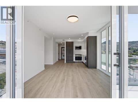 This photo is of a similar suite without the upgraded appliances. #504 has upgraded, built-in oven/microwave & induction cooktop. However, the layout is the same at 460 NICOLA Street Unit# 504, South Kamloops
