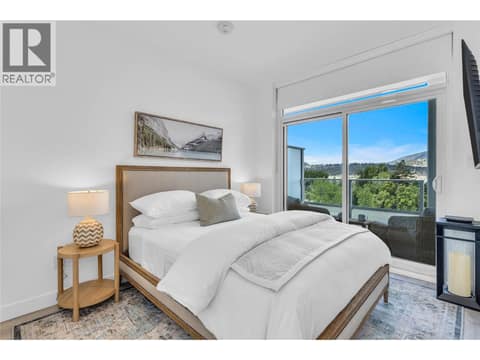 Guest bedroom with a private deck! at 238 Leon Avenue Unit# 808, Kelowna North