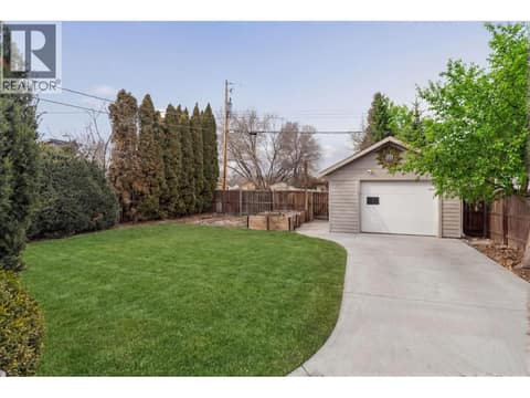 Virtually edited to show green grass and clutter removed at 2284 Aberdeen Street, Kelowna South