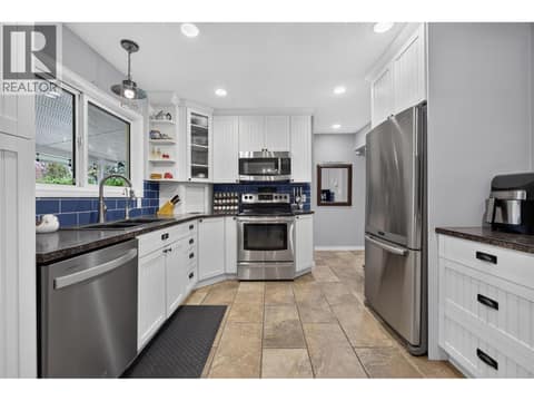 Functional kitchen with stainless steel appliances at 175 Venus Road, Rutland South, Kelowna