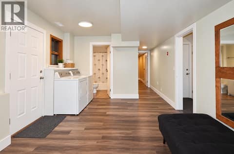 Downstairs: Laundry / Bath / Flex / Bedroom with Separate Entrance at 10590 Long Road, Lake Country South West